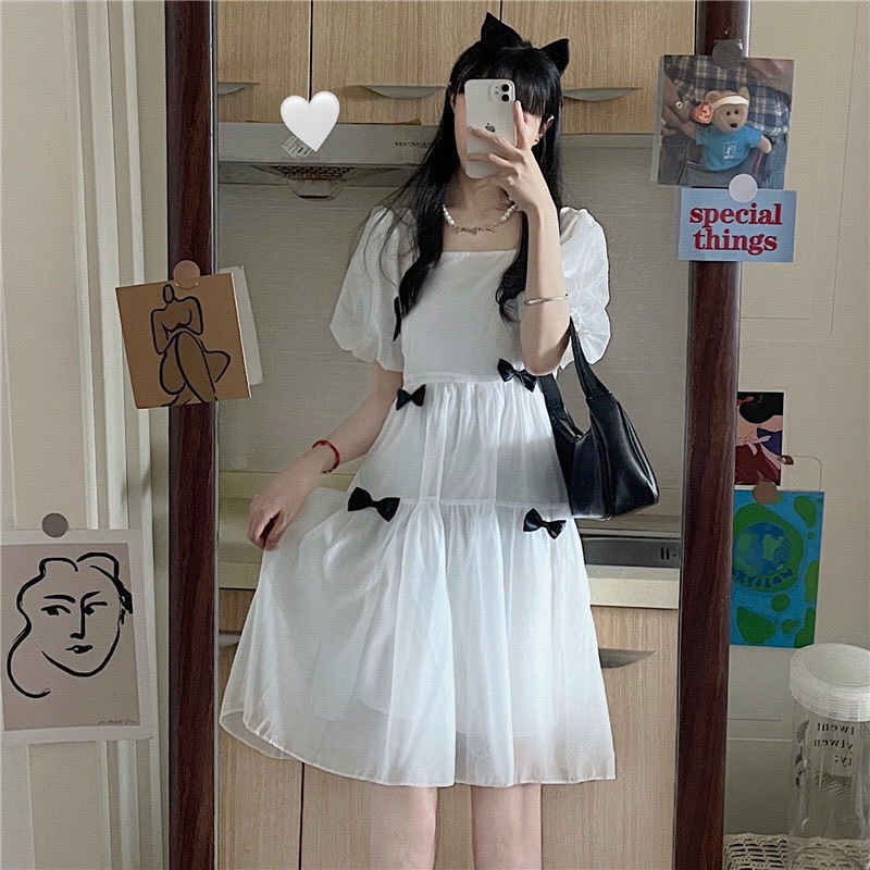 Product image Đầm tiểu thơ xinh xắn HOT TREND Váy trắng đính nơ Váy dáng dài, cổ vuông siêu xinh cho nàng [Kèm ảnh thật 100%] Trắng Ngắn