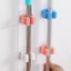 Combo 10 cái Móc dán tường kẹp giữ cây lau nhà, móc treo chổi chịu lực 6kg