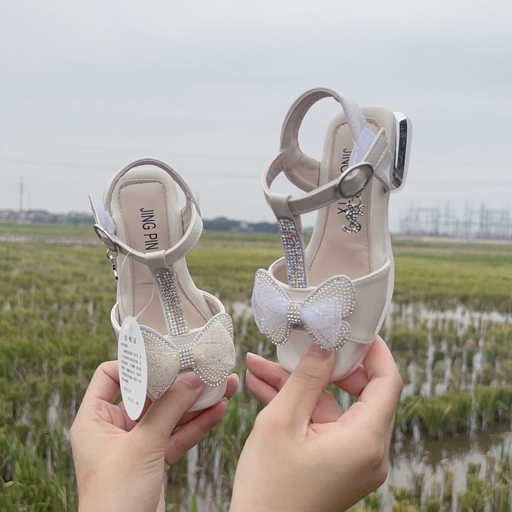 sandal cao cấp có gót cho bé gái dép quay hậu cho bé đế dẻo da bóng êm chân nơ lưới đá sng chảnh 8101