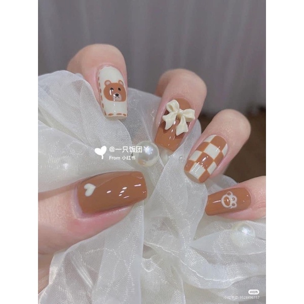 Charm nơ ( 2 cánh, dây tà dài )