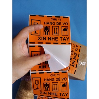 Combo 100 Tem nhãn dán cảnh báo Hàng Dễ Vỡ Xin Nhẹ Tay màu cam kích thước 10,3cm x 7,6cm