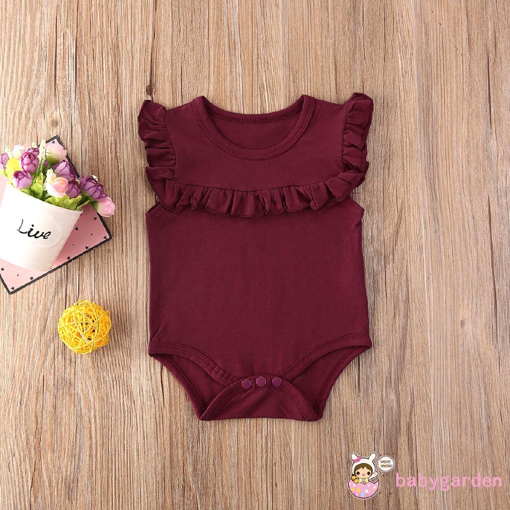 Áo liền quần cổ bèo nhún cho bé gái