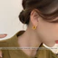 Khuyên tai titan không gỉ mạ vàng 18k dạng tròn thiết kế hoạ tiết lấp lánh phong cách trẻ trung dành cho nữ