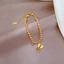 Vòng tay titan không gỉ dạng bi tròn mạ vàng 18k thiết kế mặt chữ phúc hình tai thỏ dễ thương dành cho nữ