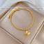 Vòng tay titan không gỉ dạng bi tròn mạ vàng 18k thiết kế mặt chữ phúc hình tai thỏ dễ thương dành cho nữ