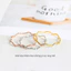 Nhẫn titan không gỉ mạ vàng 18k thiết kế hoạ tiết gợn sóng ánh lấp lánh phong cách đơn giản dành cho nữ