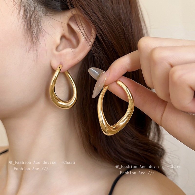 Bông tai rỗng kim bạc xoắn giọt nước Châu Âu và Hoa Kỳ xuyên biên giới gió lạnh bông tai thiết kế cá tính cảm giác bông tai mới bán buôn