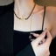 Vòng cổ choker da màu đen có đính đá và phần mở rộng lariat, phù hợp trang sức dự tiệc Y2K cổ điển