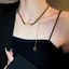 Vòng cổ choker da màu đen có đính đá và phần mở rộng lariat, phù hợp trang sức dự tiệc Y2K cổ điển