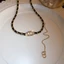 Vòng cổ choker da màu đen có đính đá và phần mở rộng lariat, phù hợp trang sức dự tiệc Y2K cổ điển