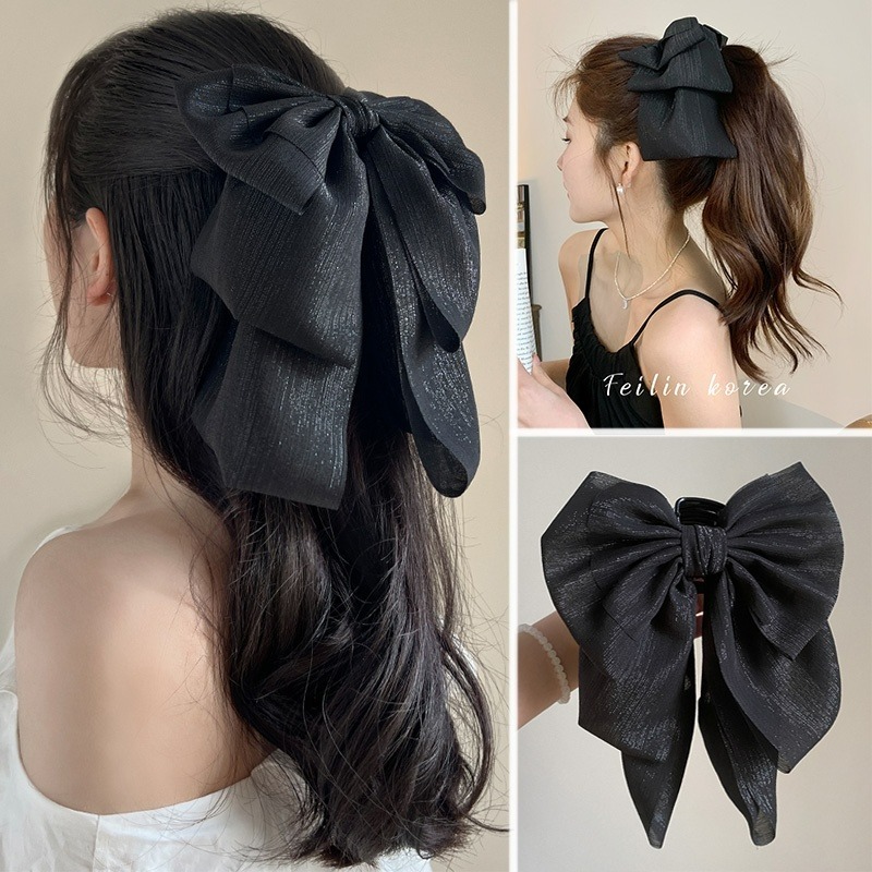 Kẹp tóc nhiều lớp nơ lớn và ruy băng tua rua, phù hợp cho cô gái tạo kiểu đuôi ngựa dài