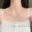 Dây chuyền titan nữ mạ vàng 18k kiểu dáng cỏ 4 lá đính đá phong cách thanh lịch