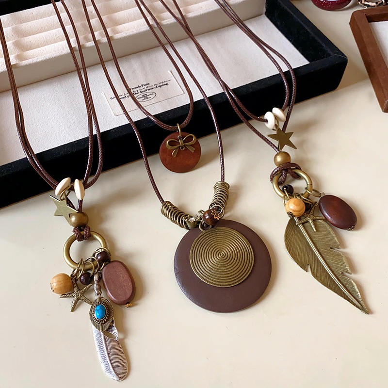 Vòng cổ mặt dây chuyền dân tộc cá tính với lông vũ và hình ngôi sao, thiết kế retro độc đáo