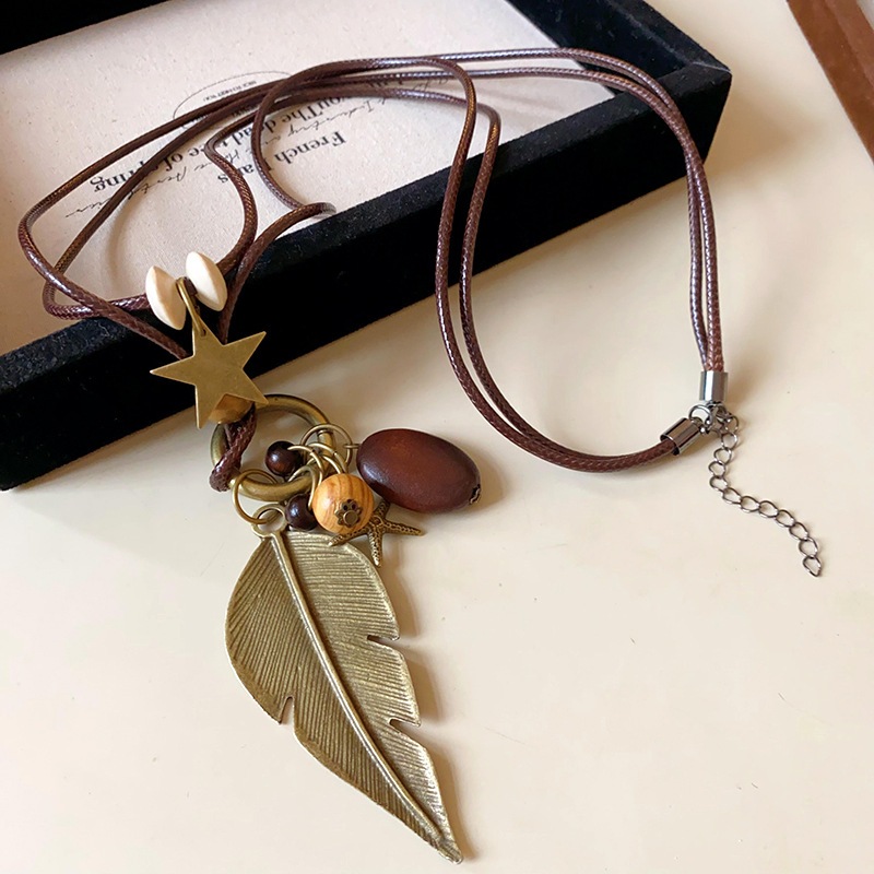 Vòng cổ mặt dây chuyền dân tộc cá tính với lông vũ và hình ngôi sao, thiết kế retro độc đáo