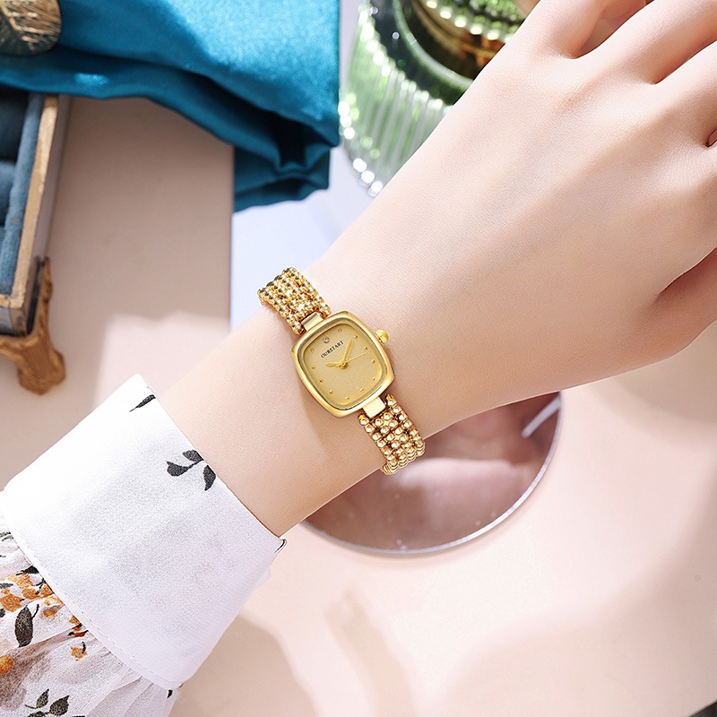 Đồng hồ nữ Ánh sáng sang trọng Mặt vuông nhỏ Mặt dây chuyền hạt Retro Nhỏ Phong cách thơm Đồng hồ nữ