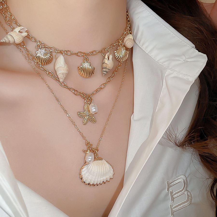 [Jewbeauty] Phong cách kỳ nghỉ bên bờ biển vỏ sao biển ốc xà cừ tua rua nhiều lớp vòng cổ thiết kế chuỗi xương đòn vòng cổ nữ