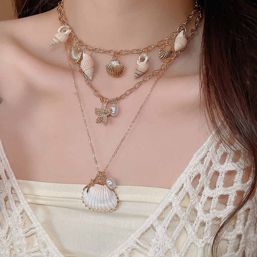 [Jewbeauty] Phong cách kỳ nghỉ bên bờ biển vỏ sao biển ốc xà cừ tua rua nhiều lớp vòng cổ thiết kế chuỗi xương đòn vòng cổ nữ