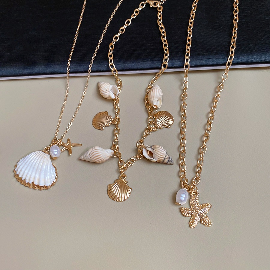 [Jewbeauty] Phong cách kỳ nghỉ bên bờ biển vỏ sao biển ốc xà cừ tua rua nhiều lớp vòng cổ thiết kế chuỗi xương đòn vòng cổ nữ