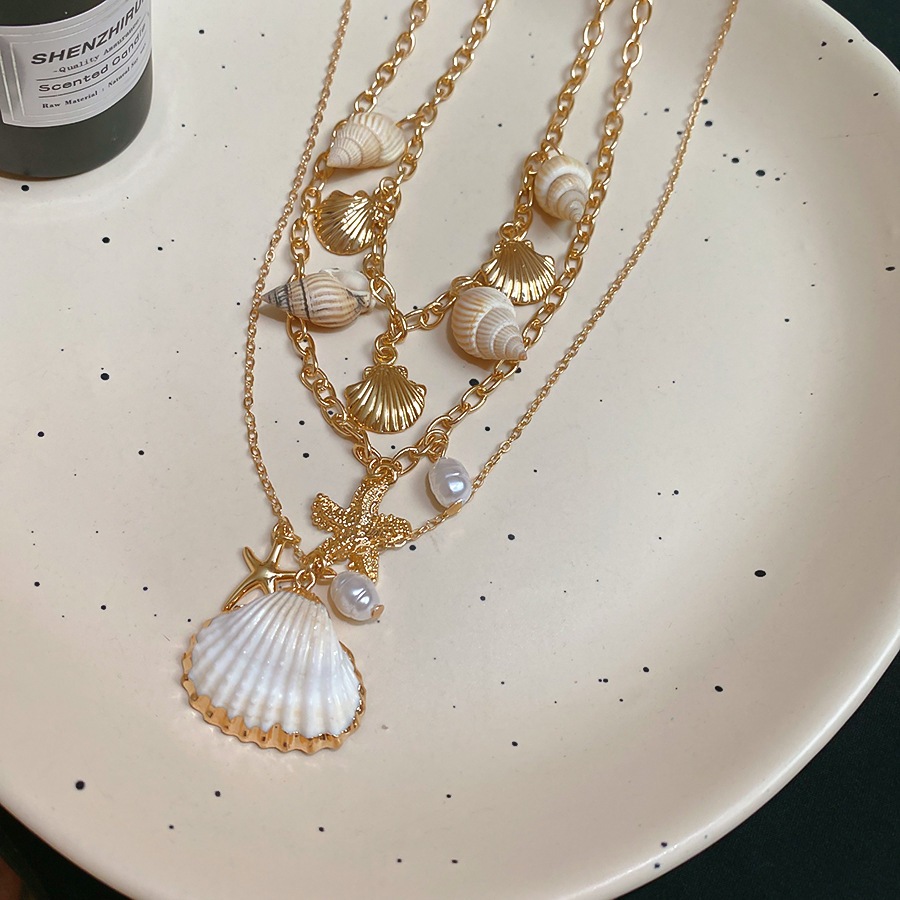 [Jewbeauty] Phong cách kỳ nghỉ bên bờ biển vỏ sao biển ốc xà cừ tua rua nhiều lớp vòng cổ thiết kế chuỗi xương đòn vòng cổ nữ