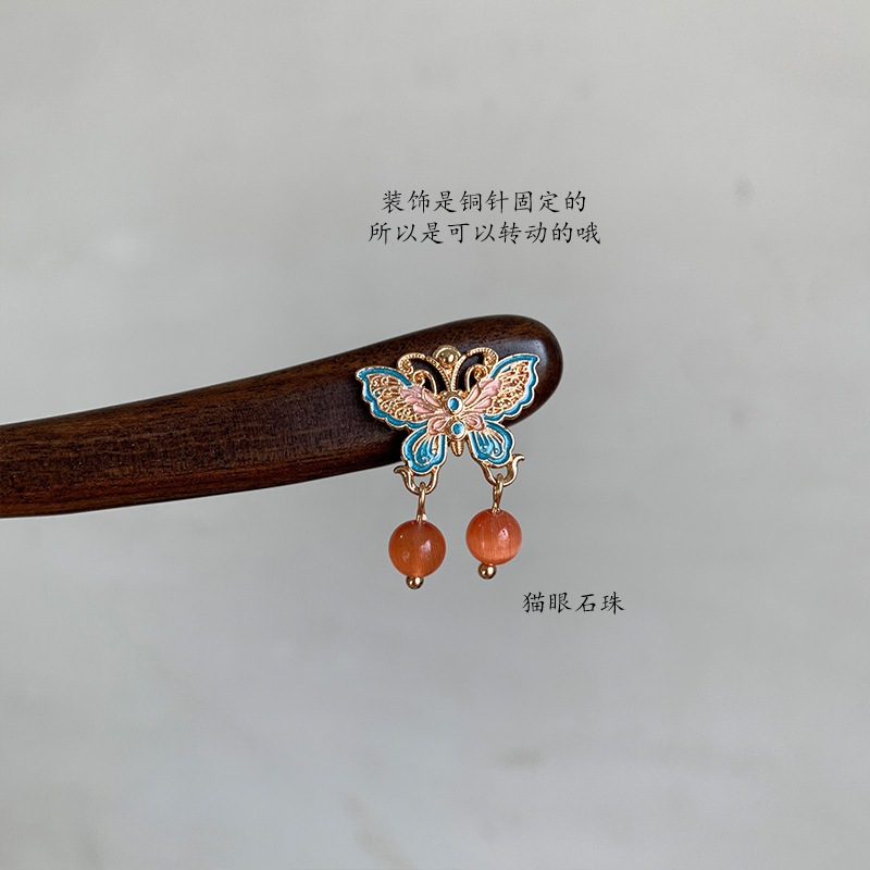 Kẹp tóc cuộn hình bướm lớn với tua rua từ gỗ đàn hương, thiết kế phong cách Trung Hoa mới mẻ.