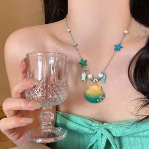 Vòng cổ gradient seashell đính hạt sao biển, ngọc trai acrylic, phù hợpwear cho bãi biển và thời trang đại dương