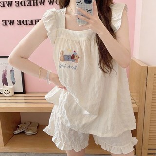 Bộ đồ ngủ nữ hai mảnh có họa tiết hoạt hình và miếng đệm hình chó, phù hợp mặc ở nhà.