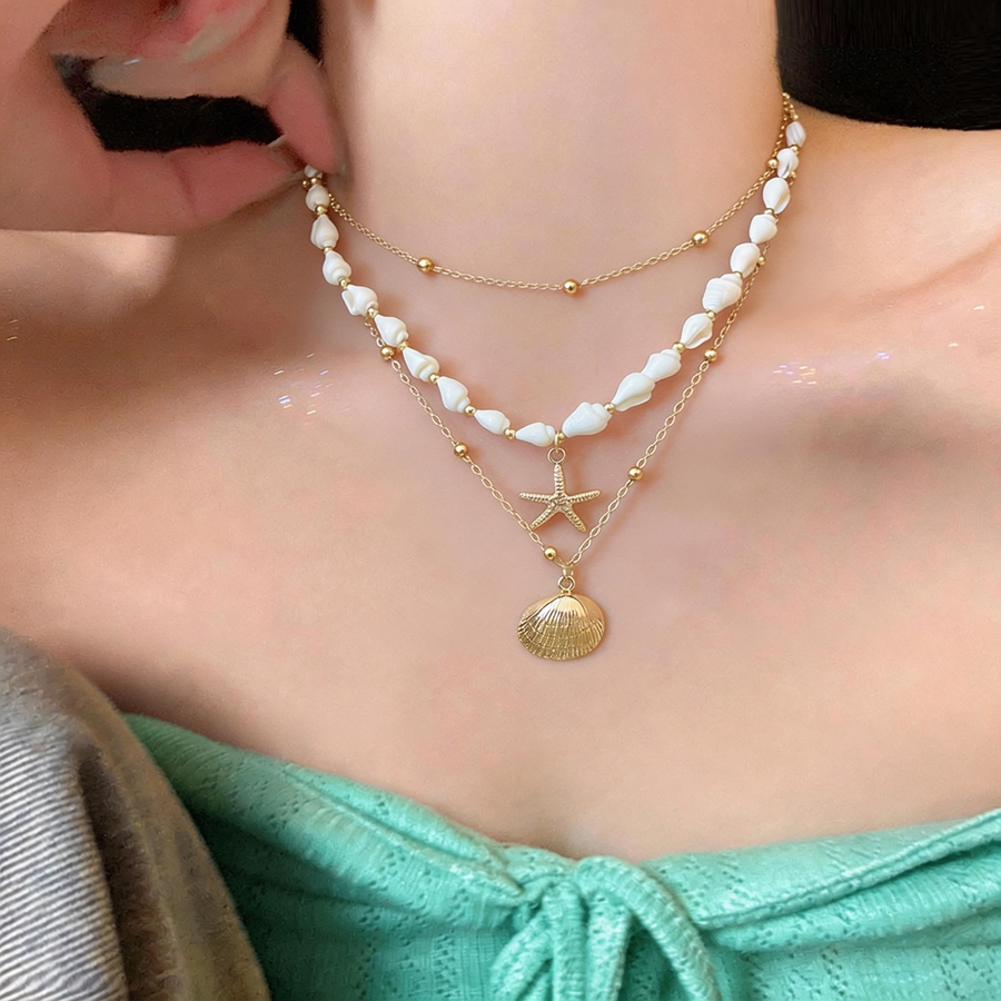 Dây chuyền và vòng cổ thời trang với biển sao và vỏ mặt, thiết kế đơn giản mà sang trọng, thanh lịch.