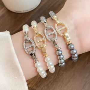 Vòng tay đính cườm ngọc trai màu vàng / bạc, khóa mũi lợn Zircon dát trang sức thanh lịch tối giản dành cho nữ