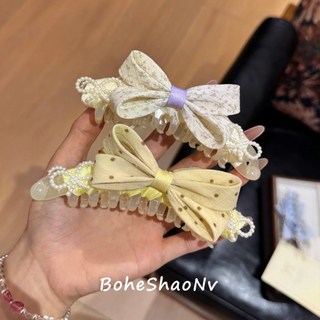Kẹp chuối nơ hoa ngọt ngào cao đuôi ngựa dọc
