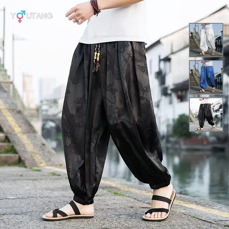 Quần harem nam màu đen in hình rồng, thiết kế ống rộng co giãn tốt