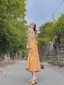 đầm vàng maxi nơ lưng