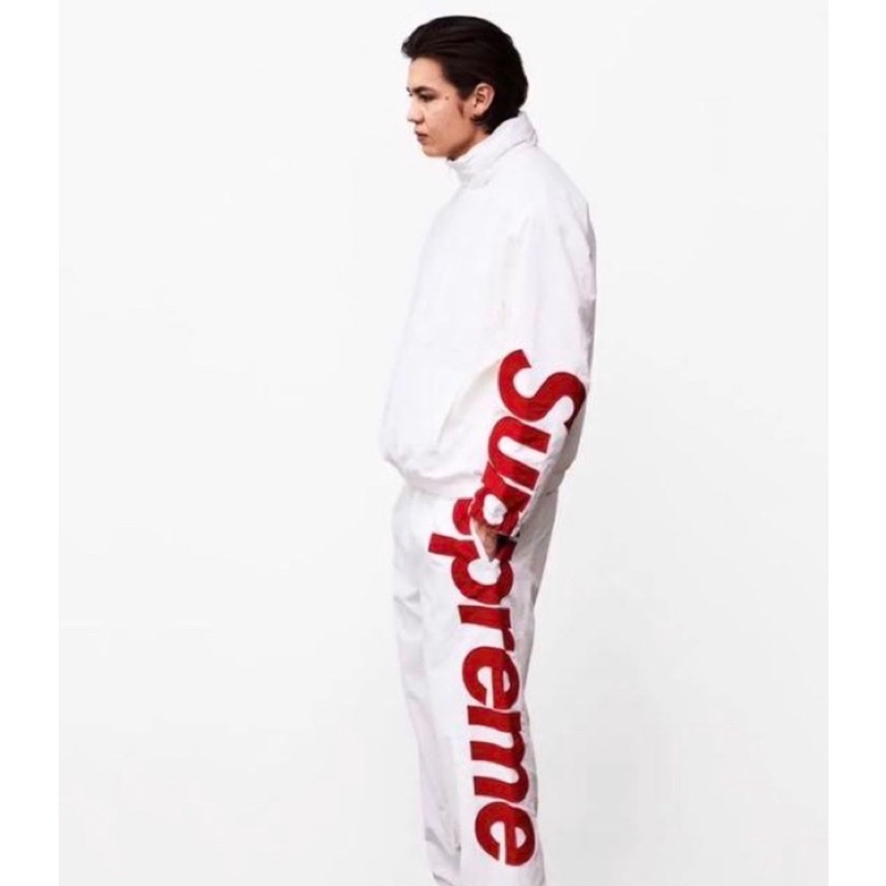 Spell out best sale track jacket supreme