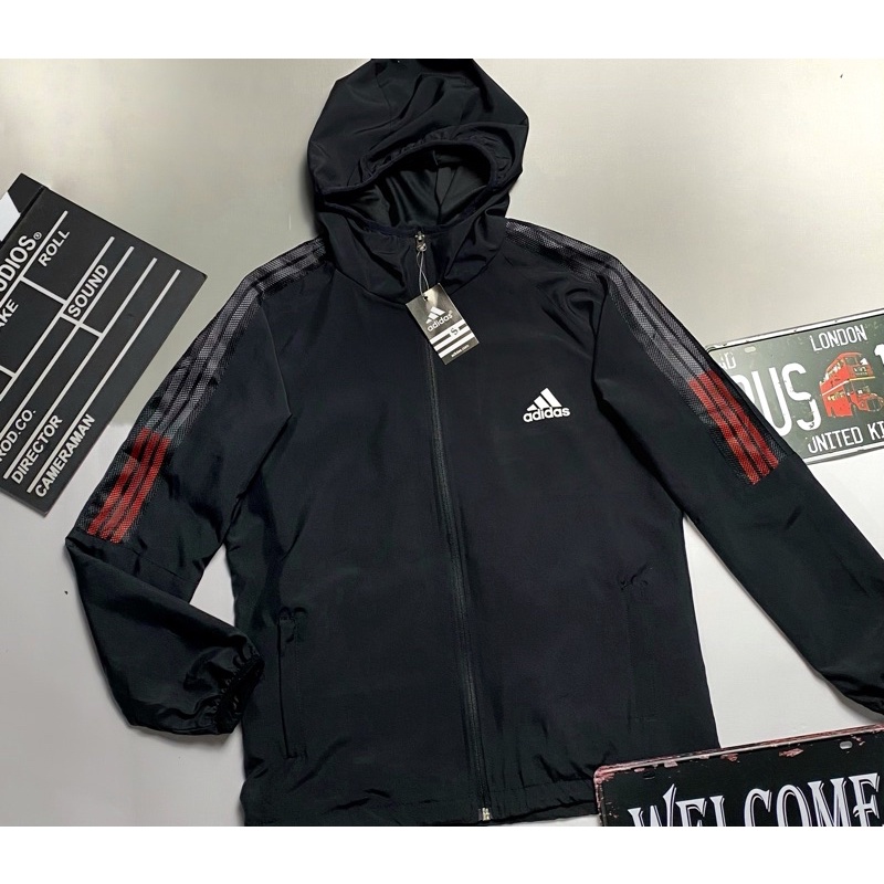 Áo Khoác Dù Nhẹ Nam Nữ Lớp Có Mũ Chống Nắng Màu Trắng Sọc Thể Thao áo  khoác gió chạy bộ thời trang Xuông có Dây Rút