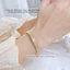 Vòng tay titan không gỉ mạ vàng 18k thiết kế 3 hàng đá lấp lánh thời trang sang trọng dành cho nữ