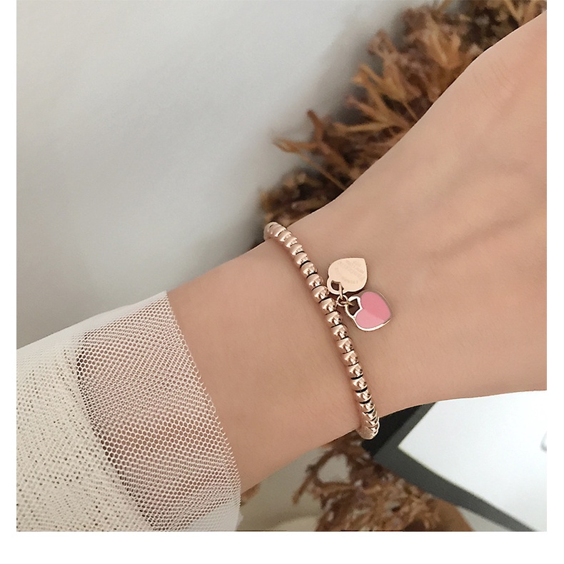 Vòng tay lắc tay nữ titan chuỗi bi tròn phối 2 mặt trái tim xanh hồng không gỉ WB191001