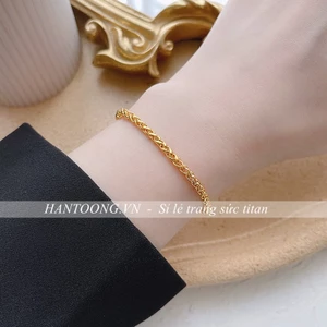 Lắc tay nữ bằng chất liệu titan không gỉ mạ vàng 24k thiết kế kiểu bện vải thời trang sang trọng