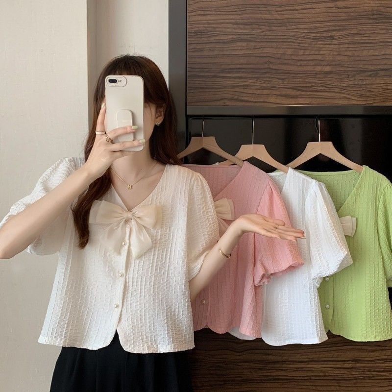 Áo sơ mi cổ chữ V dành cho nữ mùa hè 2025 phong cách mới thời trang Pháp giản dị nơ ngắn tay áo voan dành cho nữ