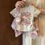Trang phục mùa hè phong cách Hàn Quốc cho bé gái, áo thun ngắn tay dễ thương hoạt hình, chân váy kẻ caro hồng không đều, bộ hai món