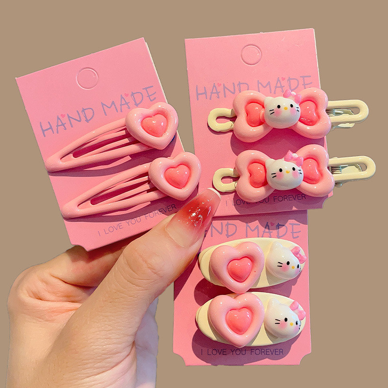 Kẹp tóc hồng cho bé gái, kẹp tóc hình trái tim bên hông, kẹp tóc trán, kẹp tóc Hello Kitty dễ thương