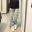 Quần jeans thẳng rách retro phiên bản Hàn Quốc mới cho nam nữ mùa xuân 2025