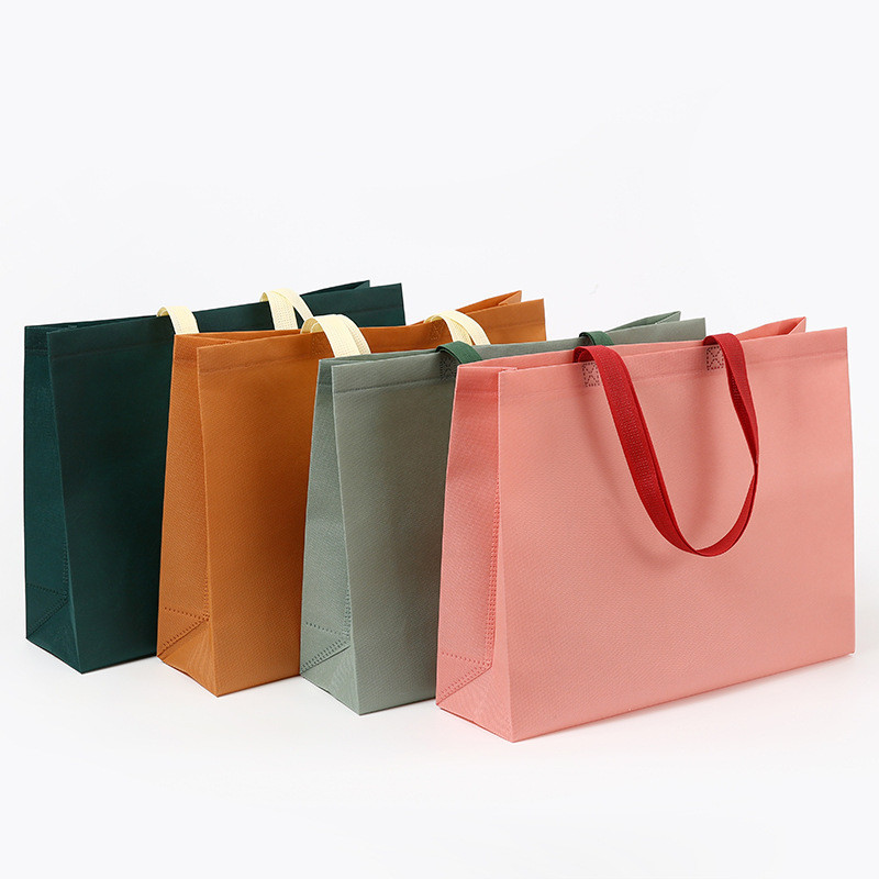 (Giá sĩ_6950đ )Túi vải không dệt kích thước 25x35x10 cm có quai vải.