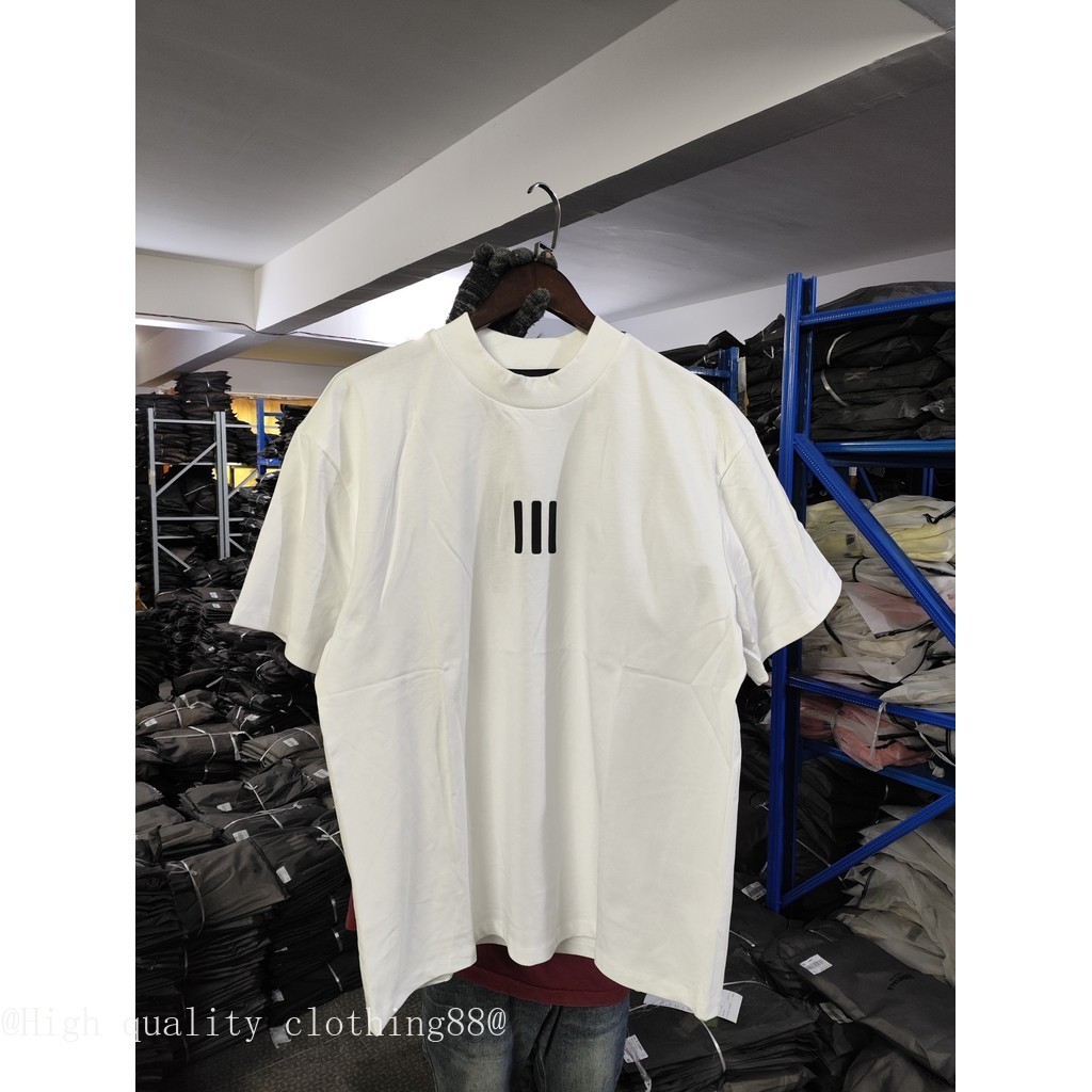 Áo thun ngắn tay FEAR OF GOD cổ cao, thiết kế ba chiều dọc, nhãn đen