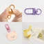 Gói số lượng lớn BTF 100 Dây buộc lò xo đầy màu sắc Móc khóa có thể xoay được Móc khóa móc cho túi