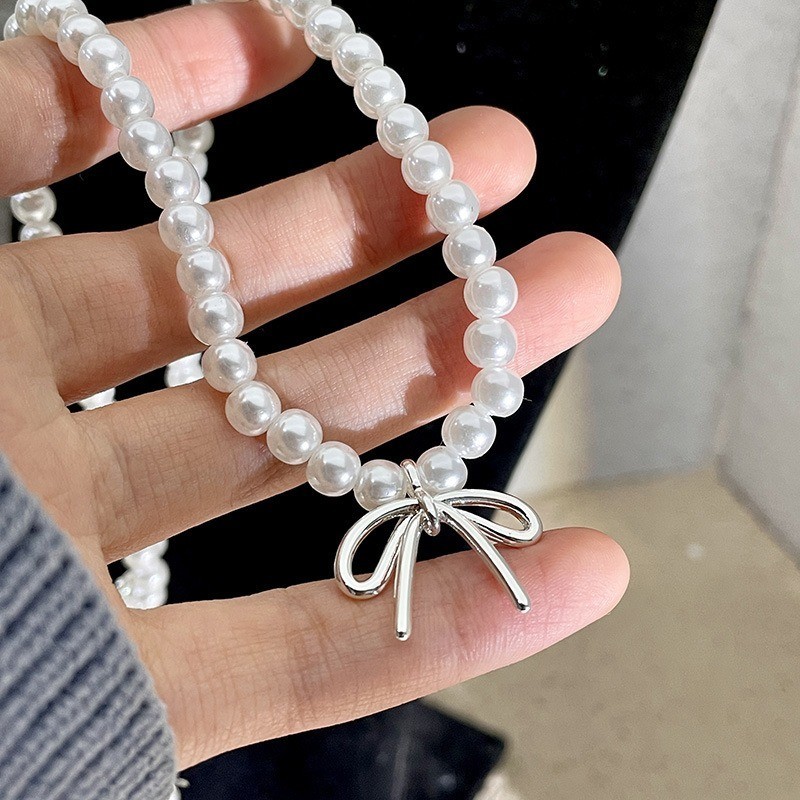 Vòng cổ mặt dây chuyền nơ ngọc trai nữ ​- Vòng cổ xương đòn nơ bé gái - Vòng cổ chuỗi bãi biển - Tính khí thời trang Pháp Thanh lịch ​- Phụ kiện trang sức phổ biến