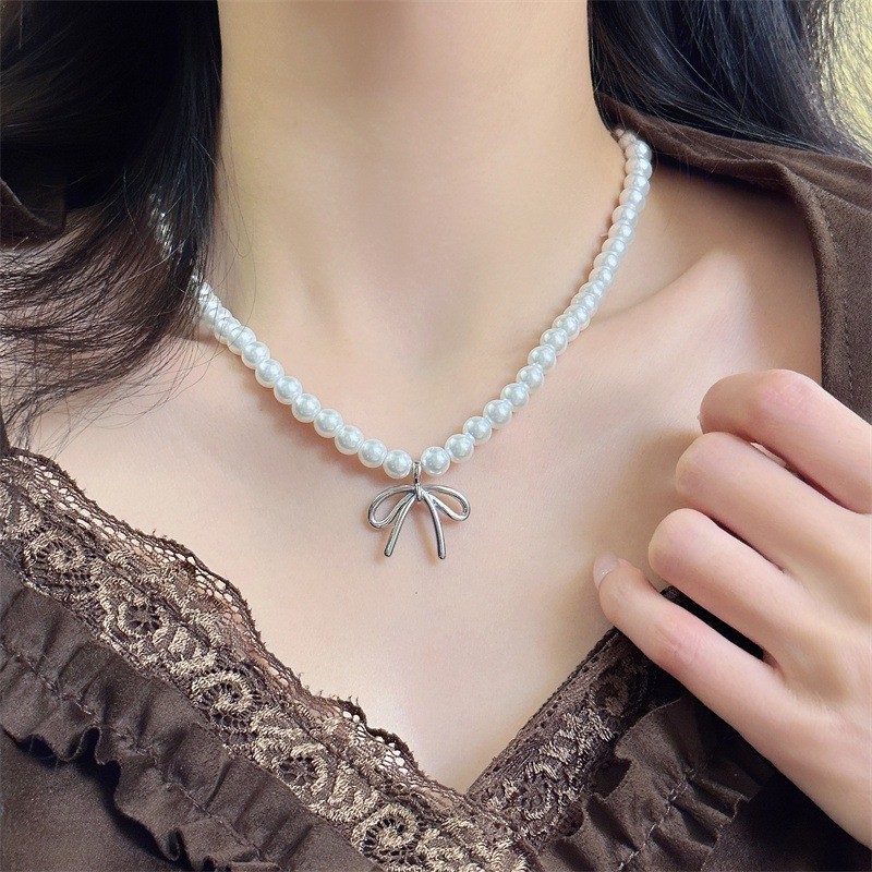Vòng cổ mặt dây chuyền nơ ngọc trai nữ ​- Vòng cổ xương đòn nơ bé gái - Vòng cổ chuỗi bãi biển - Tính khí thời trang Pháp Thanh lịch ​- Phụ kiện trang sức phổ biến
