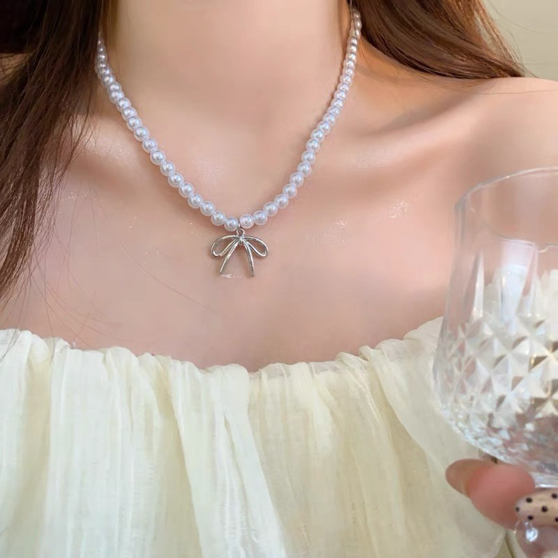 Vòng cổ mặt dây chuyền nơ ngọc trai nữ ​- Vòng cổ xương đòn nơ bé gái - Vòng cổ chuỗi bãi biển - Tính khí thời trang Pháp Thanh lịch ​- Phụ kiện trang sức phổ biến