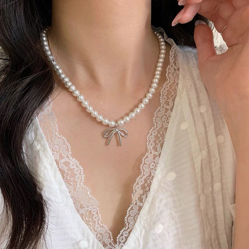 Vòng cổ mặt dây chuyền nơ ngọc trai nữ ​- Vòng cổ xương đòn nơ bé gái - Vòng cổ chuỗi bãi biển - Tính khí thời trang Pháp Thanh lịch ​- Phụ kiện trang sức phổ biến