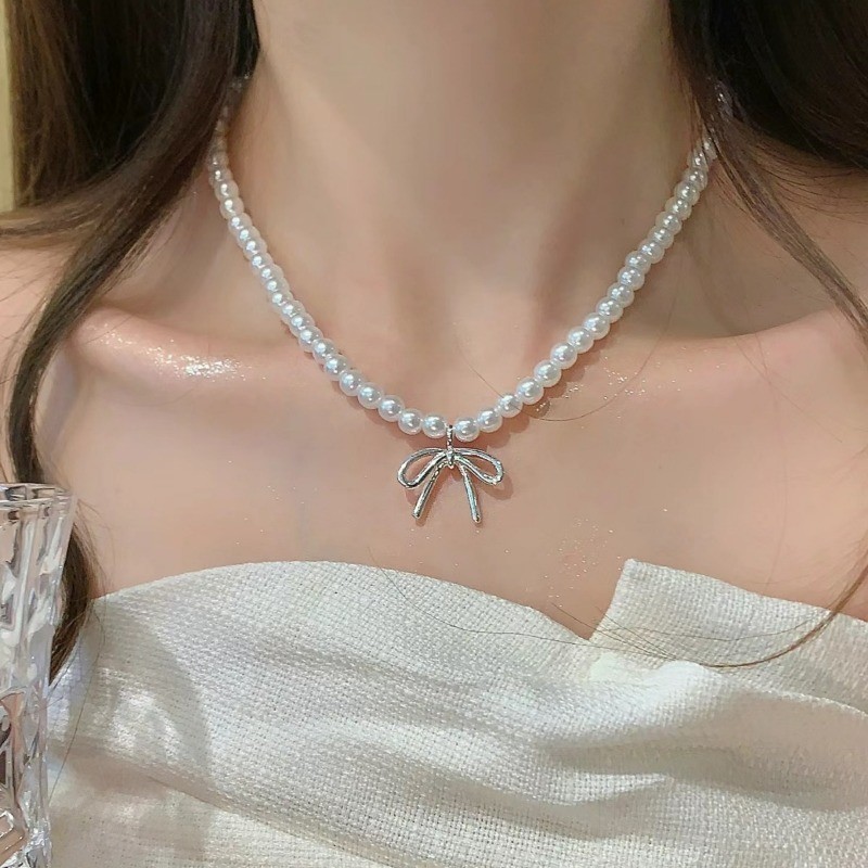 Vòng cổ mặt dây chuyền nơ ngọc trai nữ ​- Vòng cổ xương đòn nơ bé gái - Vòng cổ chuỗi bãi biển - Tính khí thời trang Pháp Thanh lịch ​- Phụ kiện trang sức phổ biến