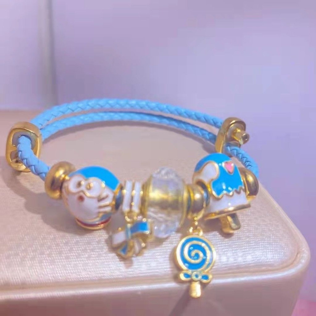 Vòng tay nữ Doremon, Kitty &amp; Snoopy chất liệu hỗn hợp thiết kế đẹp mắt - 4UNZ