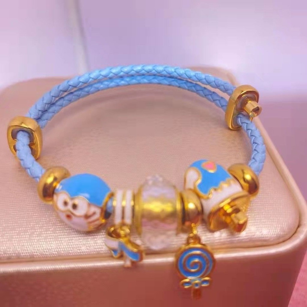 Vòng tay nữ Doremon, Kitty &amp; Snoopy chất liệu hỗn hợp thiết kế đẹp mắt - 4UNZ